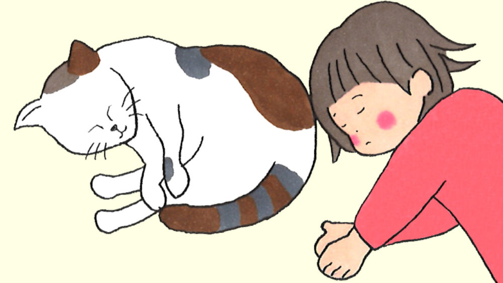 猫と寝る女の子